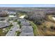Houses in a community with a pond and surrounding landscape at 19315 Hawk Valley Dr, Tampa, FL 33647