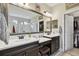 Bathroom boasts double vanity, large mirror, and walk-in shower at 19315 Hawk Valley Dr, Tampa, FL 33647