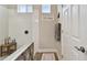 Bathroom with walk-in shower, tile surround, and modern fixtures at 19315 Hawk Valley Dr, Tampa, FL 33647