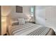 Serene bedroom featuring a striped comforter and built-in closet at 19315 Hawk Valley Dr, Tampa, FL 33647