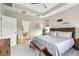 Main bedroom with king bed and access to the bathroom at 19315 Hawk Valley Dr, Tampa, FL 33647