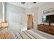 Bright bedroom with white closet doors and access to bathroom at 19315 Hawk Valley Dr, Tampa, FL 33647