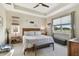 Spacious bedroom with king-size bed, large windows, and ample natural light at 19315 Hawk Valley Dr, Tampa, FL 33647