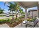 Relaxing front porch with seating area and view of neighborhood at 19315 Hawk Valley Dr, Tampa, FL 33647