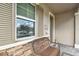 Front entry with a bench and window shutters at 19315 Hawk Valley Dr, Tampa, FL 33647