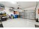 Garage with storage solutions and overhead shelving at 19315 Hawk Valley Dr, Tampa, FL 33647