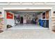 Organized garage with overhead storage and epoxy floor at 19315 Hawk Valley Dr, Tampa, FL 33647