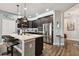 Modern kitchen with dark wood cabinets, stainless steel appliances and an island at 19315 Hawk Valley Dr, Tampa, FL 33647