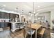 Open concept kitchen features dark brown cabinets and wood flooring at 19315 Hawk Valley Dr, Tampa, FL 33647