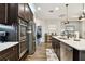Modern kitchen with dark wood cabinets and stainless steel appliances at 19315 Hawk Valley Dr, Tampa, FL 33647