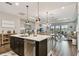 Open concept kitchen with island and stainless steel appliances at 19315 Hawk Valley Dr, Tampa, FL 33647