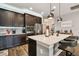 Modern kitchen with a center island and stainless steel appliances at 19315 Hawk Valley Dr, Tampa, FL 33647