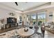 Living room with large TV and access to the backyard at 19315 Hawk Valley Dr, Tampa, FL 33647
