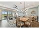Spacious living room with sliding glass doors leading to a patio at 19315 Hawk Valley Dr, Tampa, FL 33647