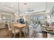 Open living room and dining area with wood flooring and neutral decor at 19315 Hawk Valley Dr, Tampa, FL 33647