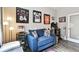 Stylish home office with blue couch and framed jerseys at 19315 Hawk Valley Dr, Tampa, FL 33647