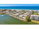 Aerial perspective highlighting the resort's waterfront location and amenities at 19417 Gulf Blvd # C-211, Indian Shores, FL 33785