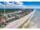 Aerial view showcasing the property's location near the beach and waterway at 19417 Gulf Blvd # C-211, Indian Shores, FL 33785