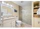 Clean bathroom with walk-in shower and updated vanity at 19417 Gulf Blvd # C-211, Indian Shores, FL 33785