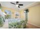 Bedroom with a queen bed, and access to balcony and full bath at 19417 Gulf Blvd # C-211, Indian Shores, FL 33785