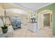 Bright dining area with table and chairs, adjacent to kitchen and bathroom at 19417 Gulf Blvd # C-211, Indian Shores, FL 33785