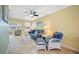 Relaxing living room featuring comfortable seating and a ceiling fan at 19417 Gulf Blvd # C-211, Indian Shores, FL 33785