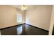 Bedroom with dark hardwood floors and a ceiling fan at 2115 Salem N Ave, St Petersburg, FL 33714