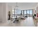 Open concept dining area with glass table and ocean view at 301 1St S St # 803, St Petersburg, FL 33701