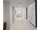 Bright hallway with modern art and tile floors at 301 1St S St # 803, St Petersburg, FL 33701