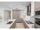 Modern kitchen with wood and white cabinetry at 301 1St S St # 803, St Petersburg, FL 33701