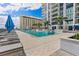 Modern pool area with plenty of lounge chairs at 301 1St S St # 803, St Petersburg, FL 33701