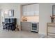 Modern wet bar with wine cooler and sleek cabinetry at 301 1St S St # 803, St Petersburg, FL 33701