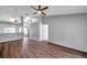 Bright living room with hardwood floors, high ceilings, and ceiling fan at 39650 Us Highway 19 N # 233, Tarpon Springs, FL 34689