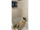Relaxing bathroom with bathtub, tiled walls, and bamboo caddy at 4220 Players Pl # 2221, Sarasota, FL 34238