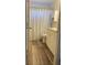 Clean bathroom with white vanity, shower/tub combo, and vinyl flooring at 4220 Players Pl # 2221, Sarasota, FL 34238