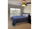 Bedroom with a full-size bed, neutral decor, and a ceiling fan at 4220 Players Pl # 2221, Sarasota, FL 34238
