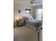 Bedroom with full-size bed, carpeted floors, and a ceiling fan at 4220 Players Pl # 2221, Sarasota, FL 34238