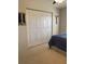 Large bedroom closet with double doors and ample storage space at 4220 Players Pl # 2221, Sarasota, FL 34238