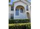 Two-story condo building with a manicured front yard and a charming entrance at 4220 Players Pl # 2221, Sarasota, FL 34238