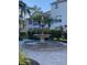 Community courtyard with an elegant tiered fountain at 4220 Players Pl # 2221, Sarasota, FL 34238