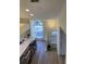 Kitchen with breakfast bar and white cabinetry at 4220 Players Pl # 2221, Sarasota, FL 34238