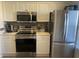 Modern kitchen featuring stainless steel appliances and light-colored cabinetry at 4220 Players Pl # 2221, Sarasota, FL 34238