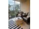 Screened lanai with wicker furniture, perfect for relaxing at 4220 Players Pl # 2221, Sarasota, FL 34238