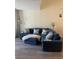 Spacious living area with sectional sofa and wood-look flooring at 4220 Players Pl # 2221, Sarasota, FL 34238