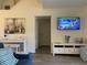 Living room with comfortable seating, a large TV, and ample natural light at 4220 Players Pl # 2221, Sarasota, FL 34238