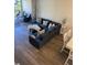 Spacious living room with sectional sofa and access to balcony at 4220 Players Pl # 2221, Sarasota, FL 34238