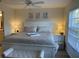 Spacious main bedroom with king-size bed and ample natural light at 4220 Players Pl # 2221, Sarasota, FL 34238