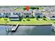 Aerial view of a house near a canal with a boat dock at 5221 Wishing Arch Dr, Apollo Beach, FL 33572
