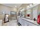 Spa-like bathroom featuring a walk-in shower and a soaking tub at 5221 Wishing Arch Dr, Apollo Beach, FL 33572