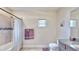 Clean bathroom with shower/tub combo, granite vanity, and updated fixtures at 5221 Wishing Arch Dr, Apollo Beach, FL 33572